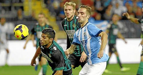 Juanfran, junto a Darder en el partido de La Rosaleda. Juanfran, junto a Darder en el partido de La Rosaleda.