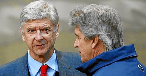Arsene Wenger junto a Pellegrini. Arsene Wenger junto a Pellegrini.
